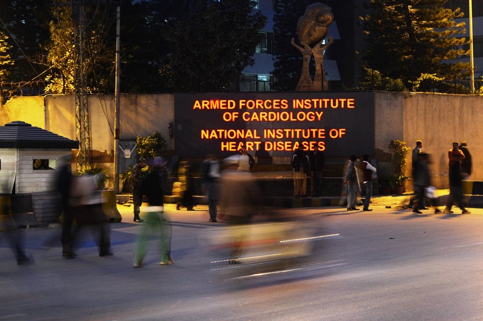 people walk past the armed forces institute of cardiology where former military ruler pervez musharraf is being treated in rawalpindi on january 2 2014 photo afp