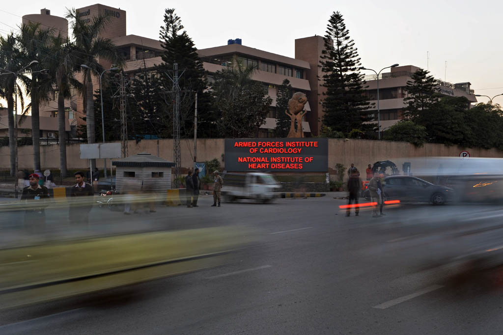 vehicles drive past the armed forces institute of cardiology where former military ruler pervez musharraf is being treated in rawalpindi on january 2 2014 photo afp