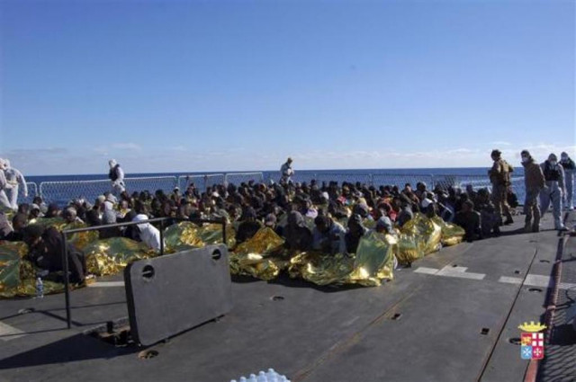 migrants sit in a marina militare vessel during a rescue operation by italian navy off the coast of the south of the italian island of sicily photo reuters migrants sit in a marina militare vessel during a rescue operation by italian navy off the coast of the south of the italian island of sicily photo reuters