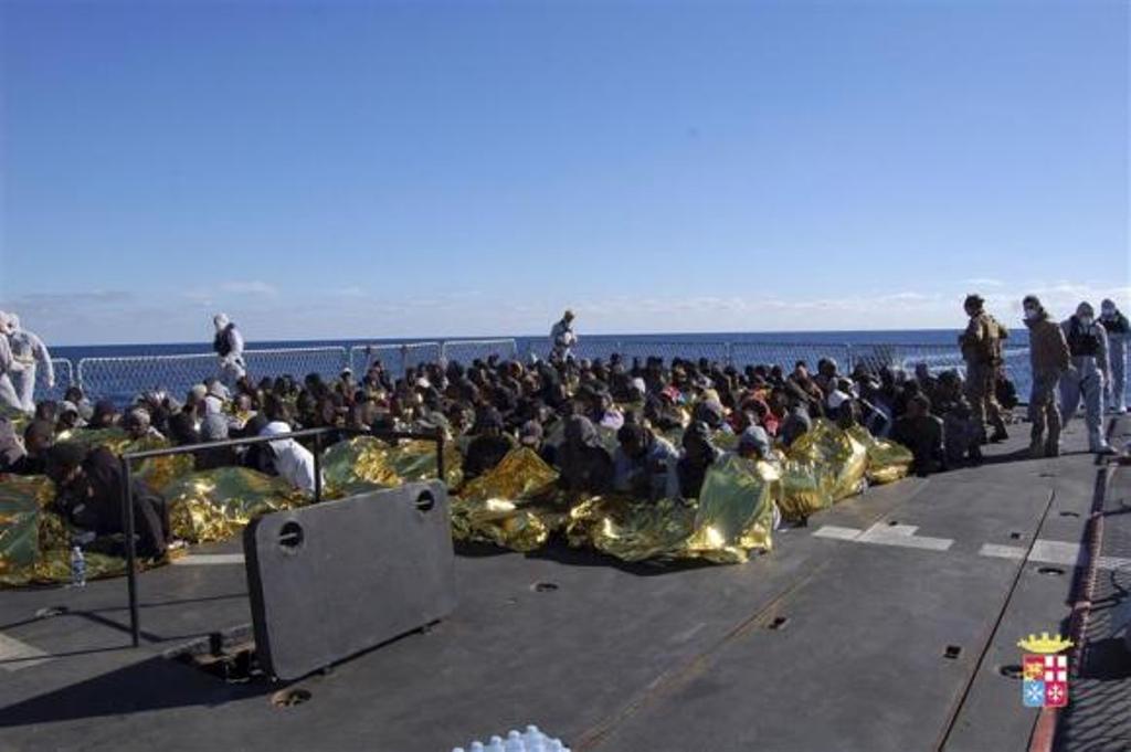 migrants sit in a marina militare vessel during a rescue operation by italian navy off the coast of the south of the italian island of sicily photo reuters