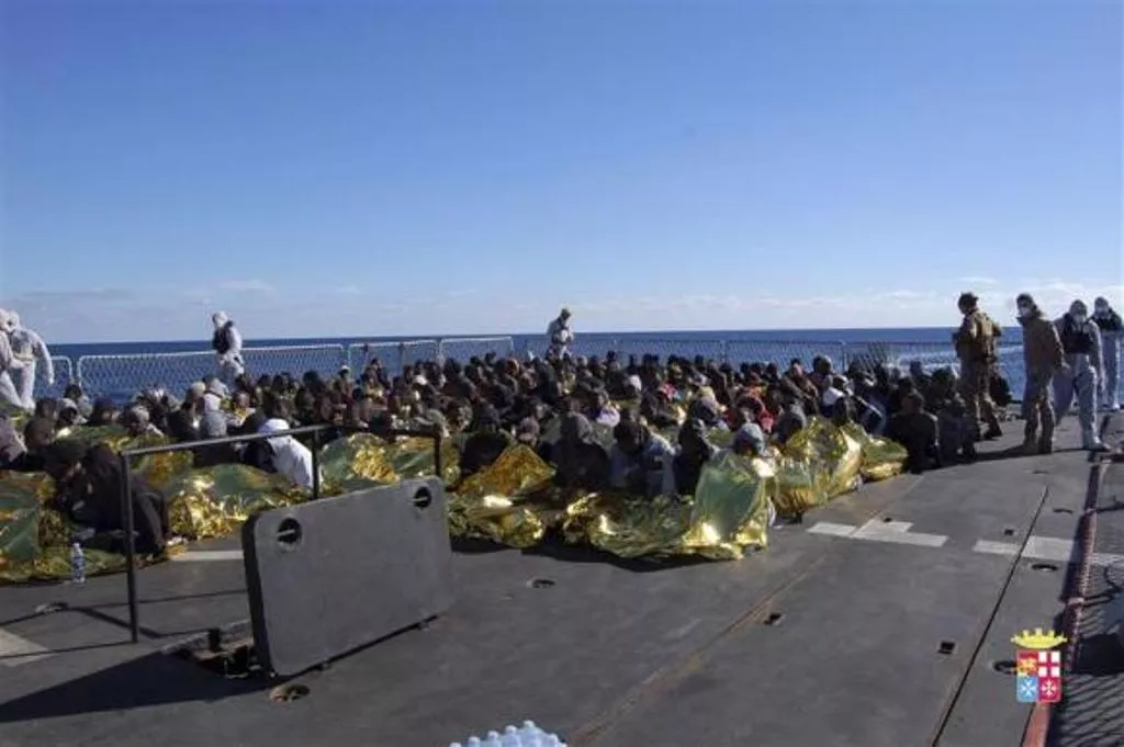 migrants sit in a marina militare vessel during a rescue operation by italian navy off the coast of the south of the italian island of sicily photo reuters migrants sit in a marina militare vessel during a rescue operation by italian navy off the coast of the south of the italian island of sicily photo reuters