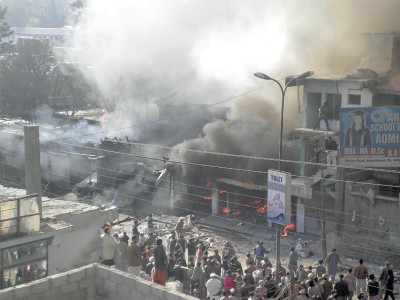 fire damages fourteen shops gutted school partially damaged in inferno