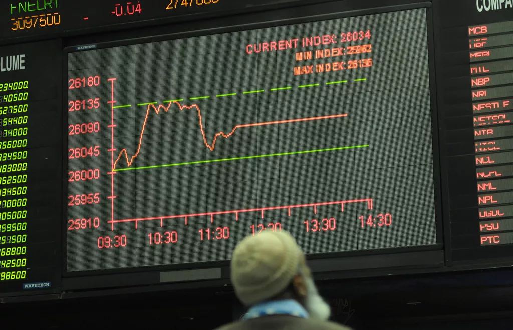 a pakistani stockbroker looks at the latest share prices on a digital screen during a trading session at the karachi stock exchange kse in karachi on january 3 2014 photo afp a pakistani stockbroker looks at the latest share prices on a digital screen during a trading session at the karachi stock exchange kse in karachi on january 3 2014 photo afp