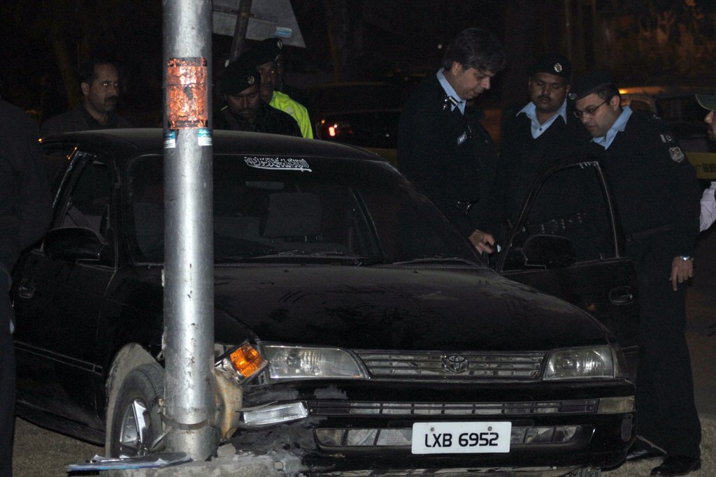 investigators inspecting the car of mufti muneer ahmed after he was killed in an attack by unknown gunmen in islamabad on january 3 photo zafar aslam express