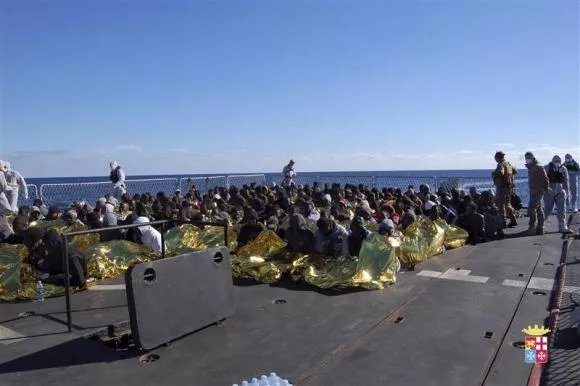 migrants sit in a marina militare vessel during a rescue operation by italian navy off the coast of the south of the italian island of sicily photo reuters migrants sit in a marina militare vessel during a rescue operation by italian navy off the coast of the south of the italian island of sicily photo reuters