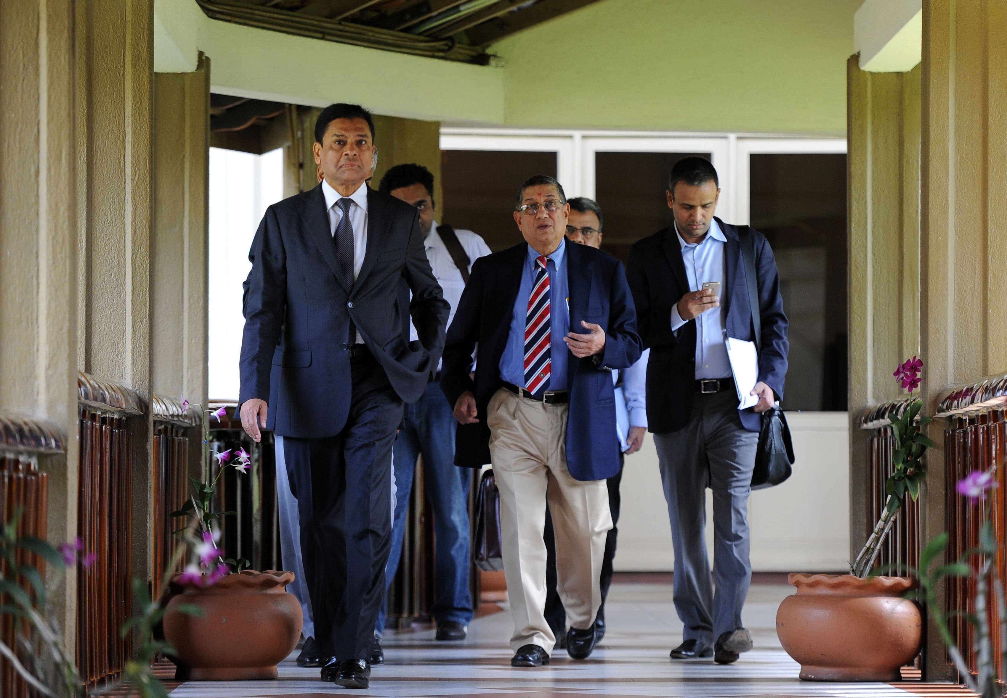 asian cricket council chairman and board of control for cricket in india bcci chief n srinivasan c chief executive of the asian cricket council syed ashraful huq l arrive for a asian cricket council acc meeting in colombo on january 4 2014 photo afp