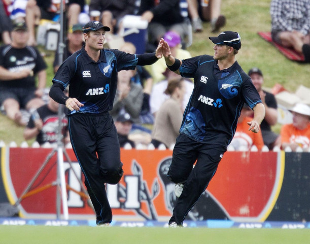 cory anderson r of new zealand congratulates teammate martin guptill for catching out lendl simmons of the west indies during the fourth international one day cricket match between new zealand and the west indies at saxton oval in nelson on january 4 2014 photo afp cory anderson r of new zealand congratulates teammate martin guptill for catching out lendl simmons of the west indies during the fourth international one day cricket match between new zealand and the west indies at saxton oval in nelson on january 4 2014 photo afp