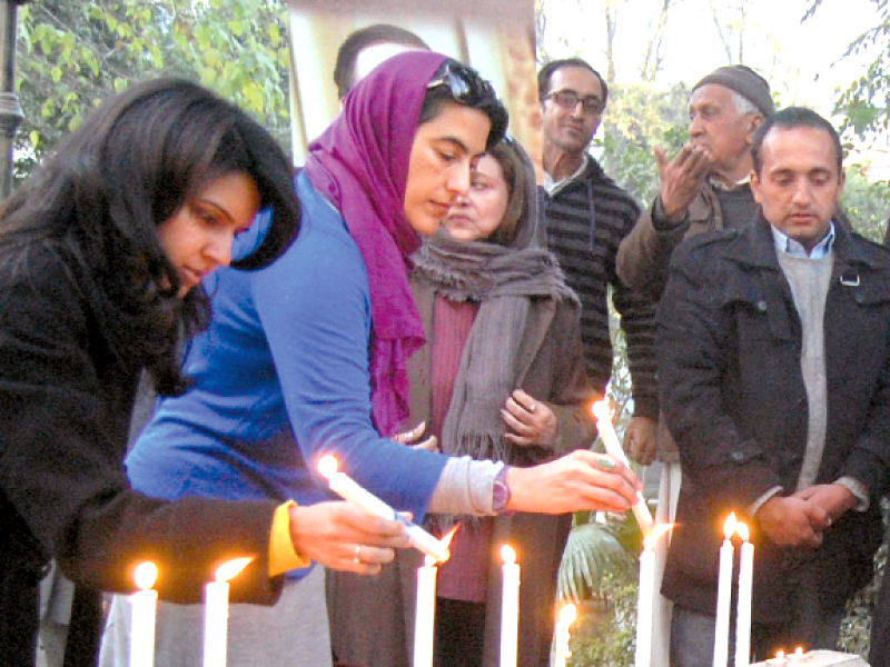 members of the public like candles in the memory of slain governor photo muhammad javaid express