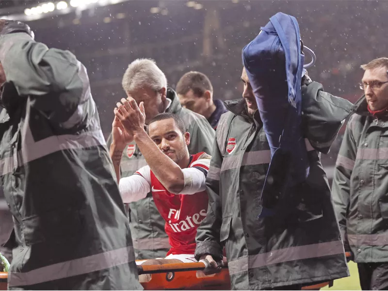 theo walcott was carried off on a stretcher after catching his studs in the turf while attempting a challenge photo afp theo walcott was carried off on a stretcher after catching his studs in the turf while attempting a challenge photo afp