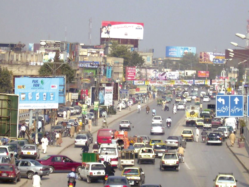 banners and hoardings intrude on the surrounding landscape with bright colours lights and large fonts making it difficult to focus on anything else photo file