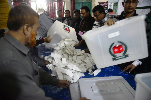 bangladeshi election officials open a ballot box to count votes after polls closed in a polling station in dhaka on january 5 2014 photo afp bangladeshi election officials open a ballot box to count votes after polls closed in a polling station in dhaka on january 5 2014 photo afp
