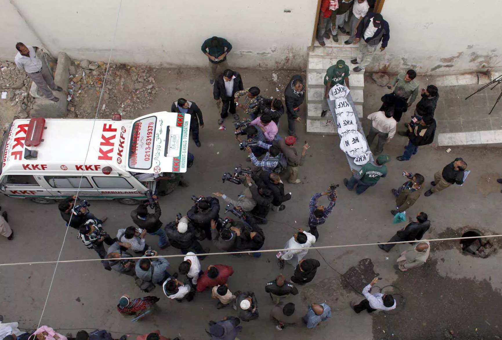 rescue officials remove bodies from an ambulance that had been recovered from a shrine in gulshan e maymar on tuesday photo mohammad azeem express rescue officials remove bodies from an ambulance that had been recovered from a shrine in gulshan e maymar on tuesday photo mohammad azeem express