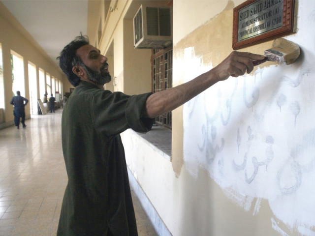 sindh assembly s deputy secretary siraj fatima spray painted slogans on the walls of the sindh assembly building the slogans were against her boss the secretary of the assembly the painter above is painting over the statement quot remove illegal omar farooq immediately quot photo athar khan express sindh assembly s deputy secretary siraj fatima spray painted slogans on the walls of the sindh assembly building the slogans were against her boss the secretary of the assembly the painter above is painting over the statement quot remove illegal omar farooq immediately quot photo athar khan express