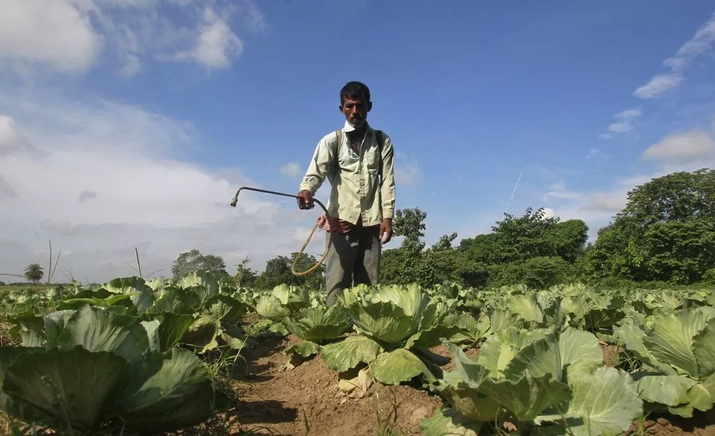 a farmer spraying fertilizer on a field photo reuters a farmer spraying fertilizer on a field photo reuters