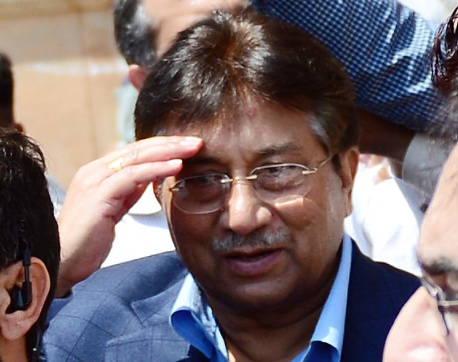 former president pervez musharraf raises his hands after appearing at the sindh hight court in karachi on march 29 2013 photo afp