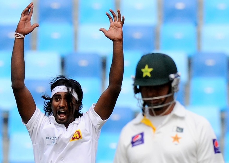 bowler nuwan pradeep l celebrates after dismissing batsman ahmed shehzad during the opening day of the second cricket test match between pakistan and sri lanka at the dubai international cricket stadium in dubai on january 8 2014 photo afp