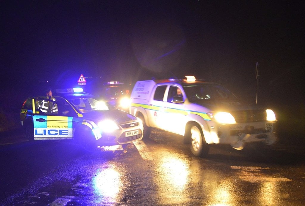 emergency vehicles drive past a police road block in the village of cley in norfolk east england january 8 2014 photo reuters