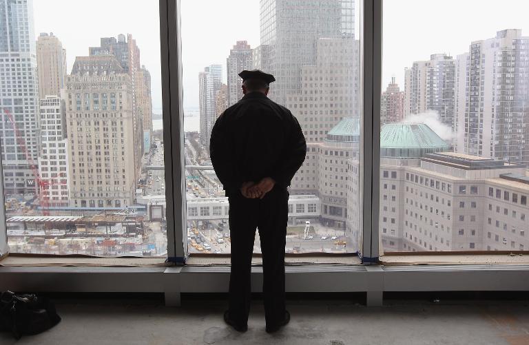a police officer overlooking ground zero photo afp