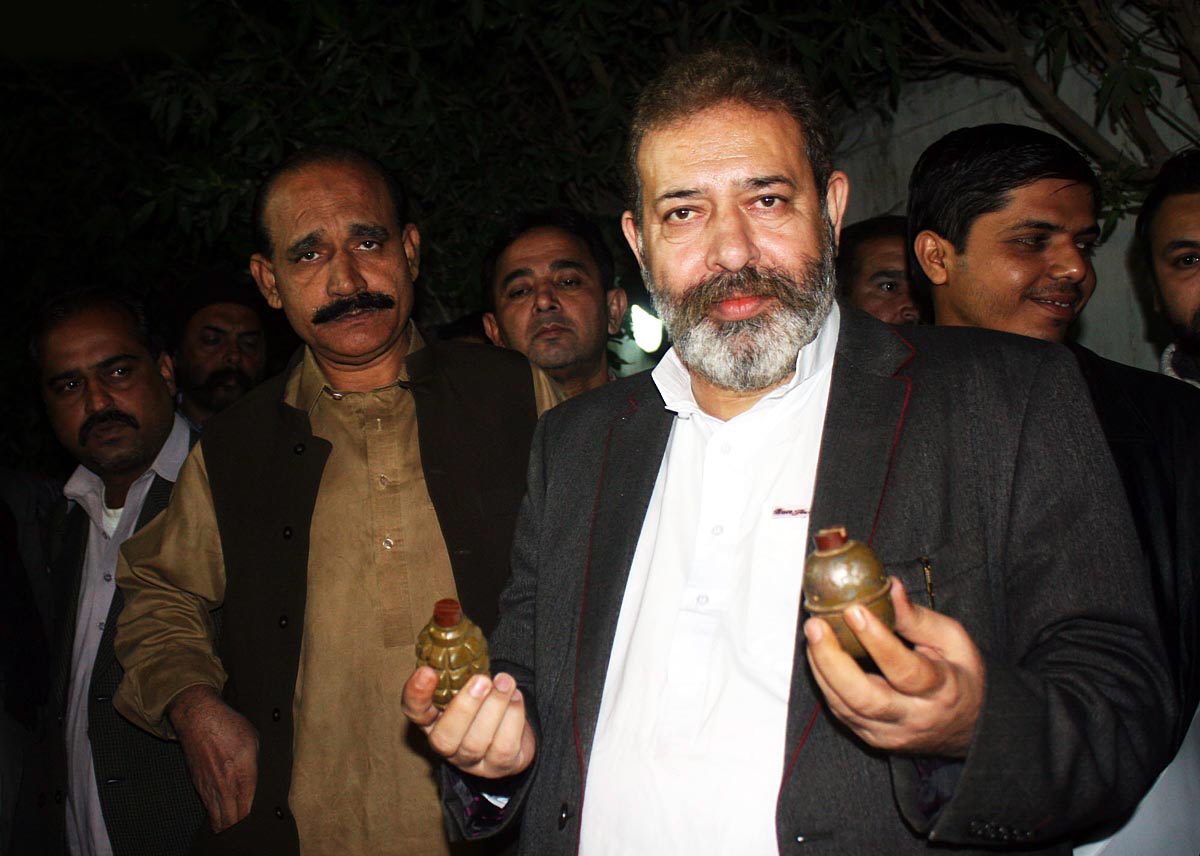sp cid chaudhry muhammad aslam showing hand grenades recovered from a cid operation against ttp militants on january 21 2013 in karachi photo online