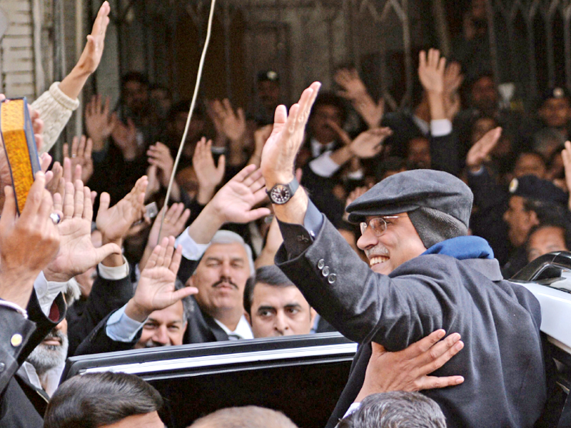 former president zardari waves his supporters outside the accountability court photo afp