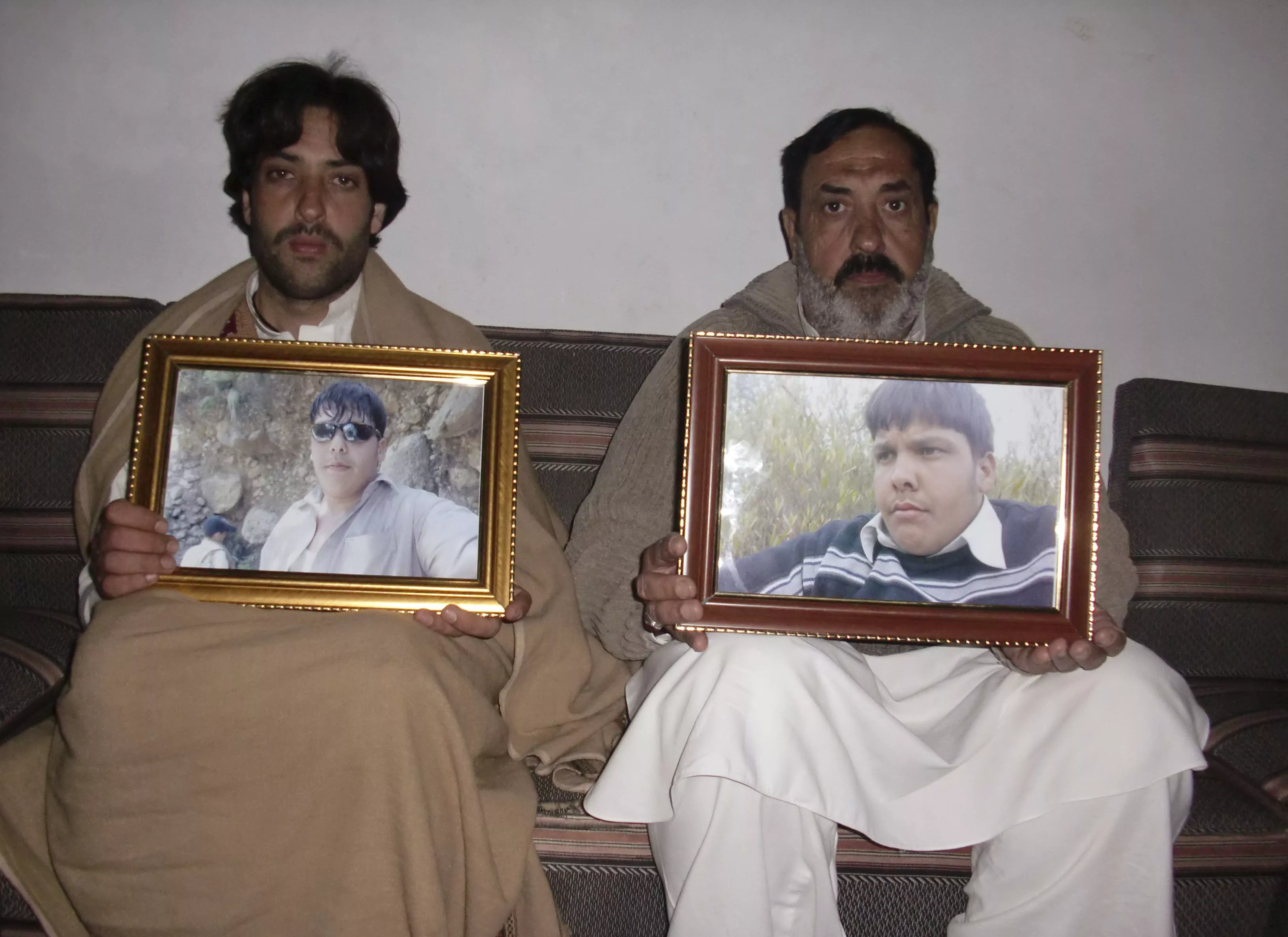 mujahid ali r and mujtaba hasan the father and brother respectively of aitizaz hasan pose for the camera with framed pictures of hassan at their residence in hangu district bordering north waziristan january 10 2014 photo reuters mujahid ali r and mujtaba hasan the father and brother respectively of aitizaz hasan pose for the camera with framed pictures of hassan at their residence in hangu district bordering north waziristan january 10 2014 photo reuters