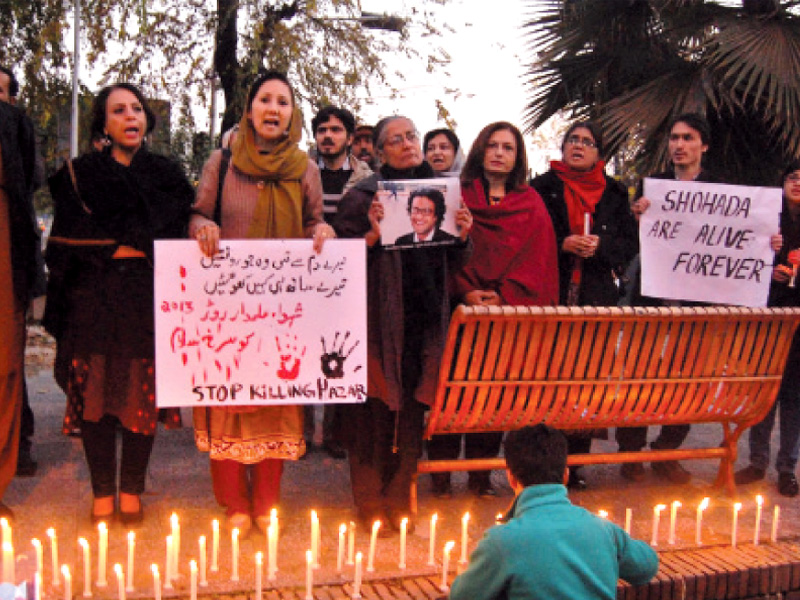 candles on first death anniversary of irfan ali khudi a young activist killed in a deadly attack on the hazara community in quetta photo muhammad javaid express