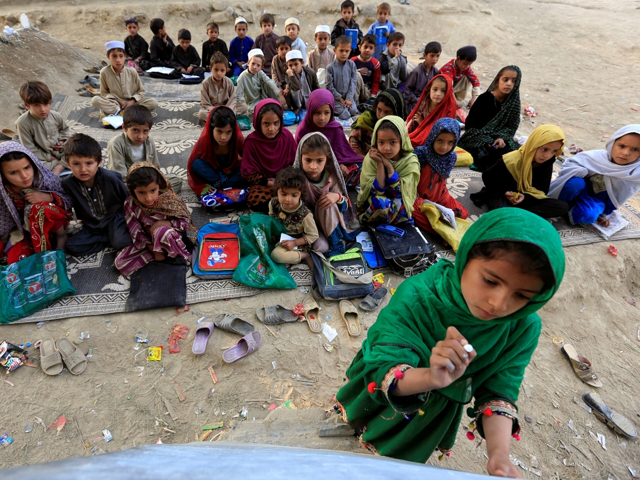afghan children study at an open area in ghani khel district of jalalabad afghanistan photo reuters