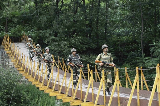 indian border security force bsf soldiers patrol over a footbridge built over a stream near the line of control loc a ceasefire line dividing kashmir between india and pakistan at sabjiyan sector of poonch district august 8 2013 photo reuters indian border security force bsf soldiers patrol over a footbridge built over a stream near the line of control loc a ceasefire line dividing kashmir between india and pakistan at sabjiyan sector of poonch district august 8 2013 photo reuters