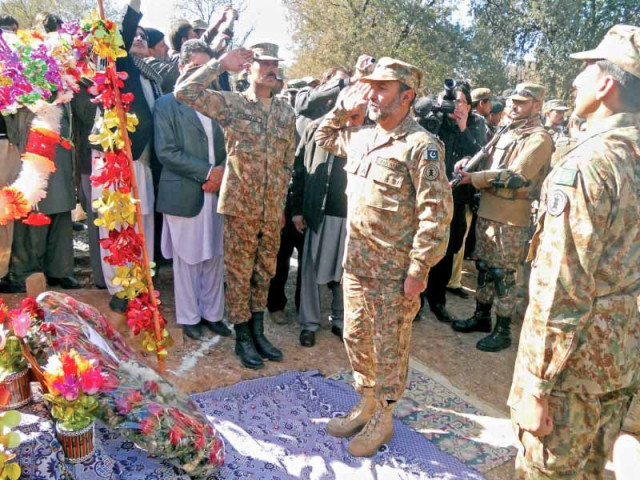 hangu commander brigadier nadeem zaki pays tribute to the late aitizaz hasan and lays a floral wreath on behalf of army chief general raheel sharif photo afp hangu commander brigadier nadeem zaki pays tribute to the late aitizaz hasan and lays a floral wreath on behalf of army chief general raheel sharif photo afp
