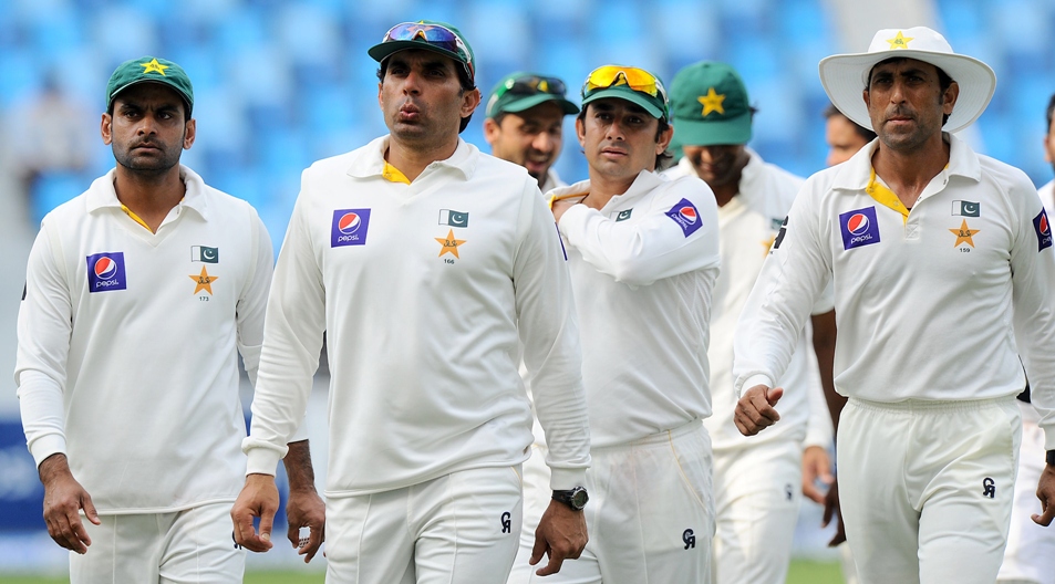 misbah ul haq 2l and teammates leave the field at the end of the second test match between pakistan and sri lanka at the dubai international cricket stadium in dubai on january 12 2014 photo afp