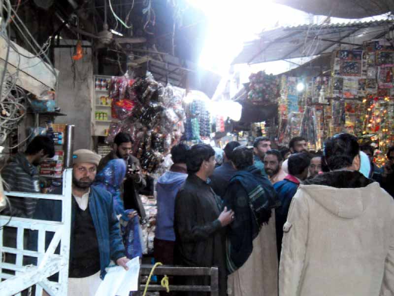 the already narrow streets of the bazaar have been encroached by shopkeepers and vendors photo kashif abbasi express