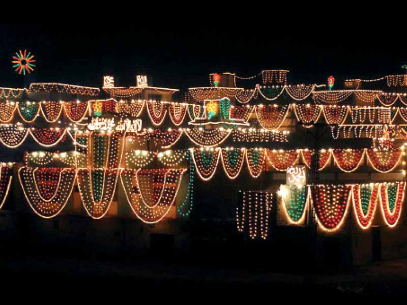 buildings in dhoke matkal area in rawalpindi decorated with colourful lights photo online