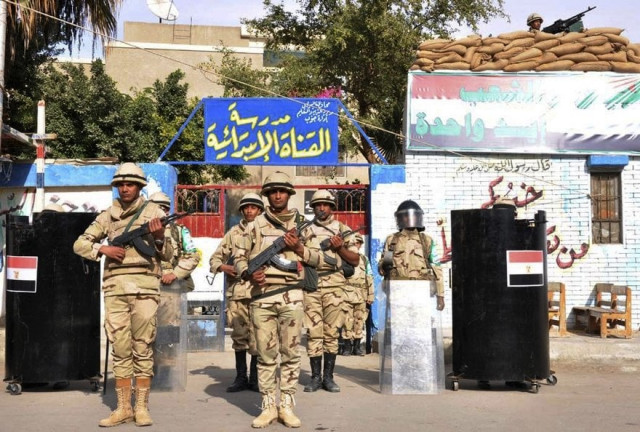 egyptian soldiers stand guard in the courtyard of a school that will be used as a polling station in port said january 13 2014 photo reuters egyptian soldiers stand guard in the courtyard of a school that will be used as a polling station in port said january 13 2014 photo reuters