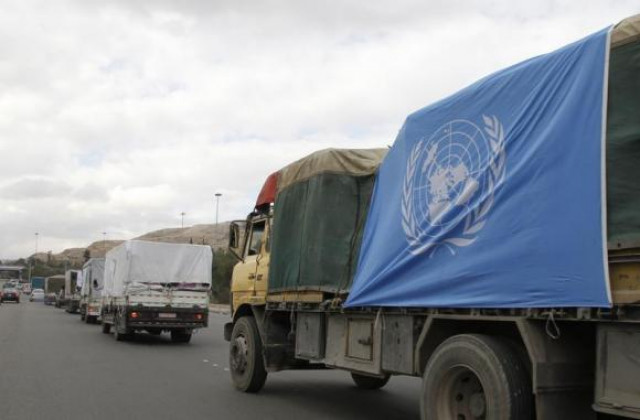 trucks carrying food aid offered from unrwa make their way to the besieged camp of al yarmouk south of damascus photo reuters