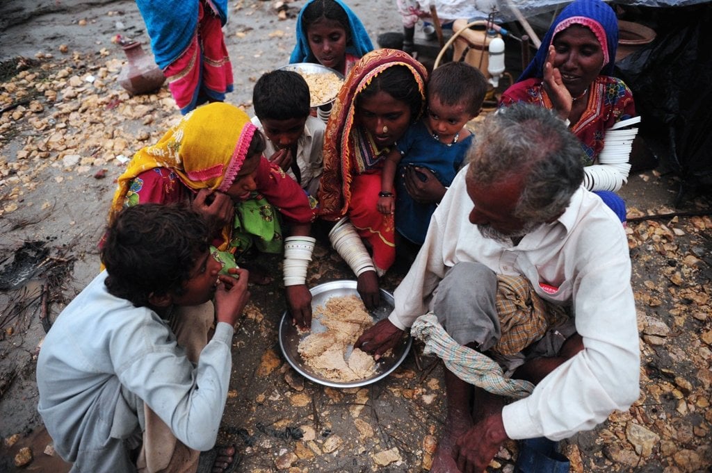 a family in badin pakistan eating food photo afp