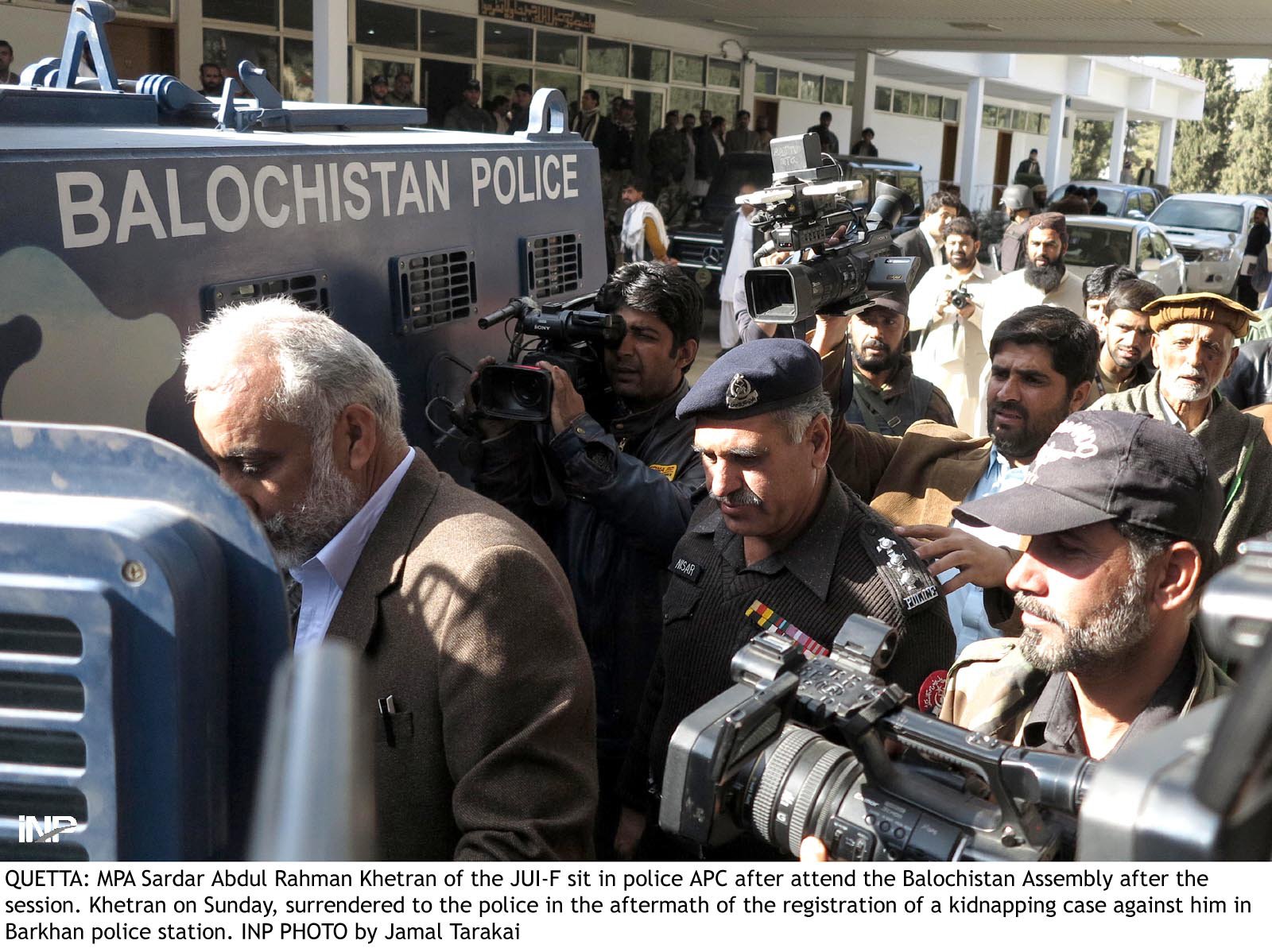 jui f mpa sardar abdul rehman khetran l sits in an armoured police van after attending the balochistan assembly before being transferred to his house in quetta which had been declared a sub jail photo inp