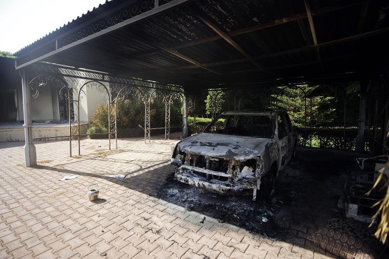 a picture shows a burnt vehicle inside the us consulate compound in benghazi on september 13 2012 photo afp