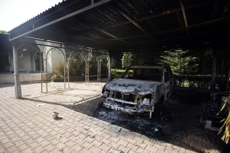 a picture shows a burnt vehicle inside the us consulate compound in benghazi on september 13 2012 photo afp a picture shows a burnt vehicle inside the us consulate compound in benghazi on september 13 2012 photo afp