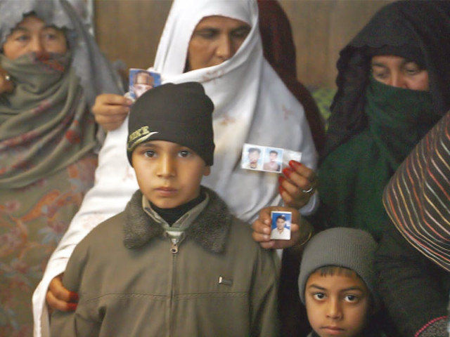 relatives of missing persons stand with pictures of their loved ones photo ppi file relatives of missing persons stand with pictures of their loved ones photo ppi file