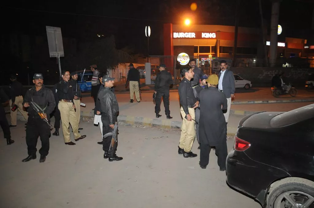 police officials inspecting the area after the attack on express news van on january 17 2014 photo express mohammad noman police officials inspecting the area after the attack on express news van on january 17 2014 photo express mohammad noman