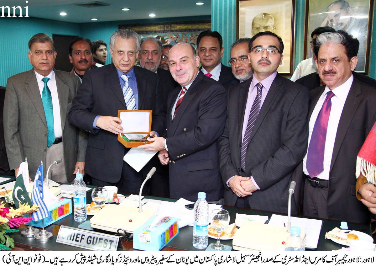 greece ambassador to pakistan petros mavroidis receiving a shield from the lahore chamber of commerce and industry president engr sohail lashari photo nni