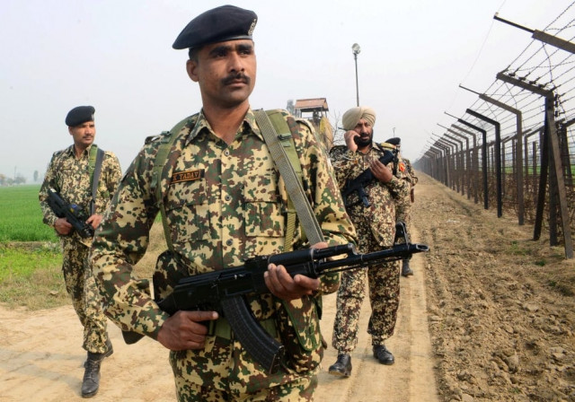 indian border security force soldiers patrol along the india pakistan border fence about 27 km from wagah on january 13 2013 photo afp indian border security force soldiers patrol along the india pakistan border fence about 27 km from wagah on january 13 2013 photo afp
