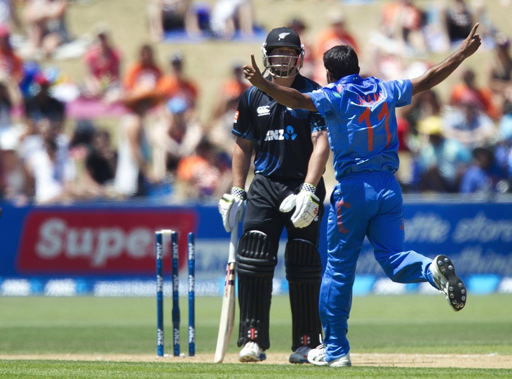 mohammed shami r of india celebrates jesse ryder of new zealand being bowled out during the first one day international odi cricket match between new zealand and india at mclean park in napier on january 19 2014 photo afp