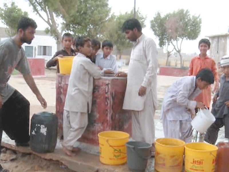 due to the contamination of underground water in malir district villagers have to travel a distance of one kilometres to obtain sweet water from wells of nearby agricultural lands photos courtesy health and nutrition development society