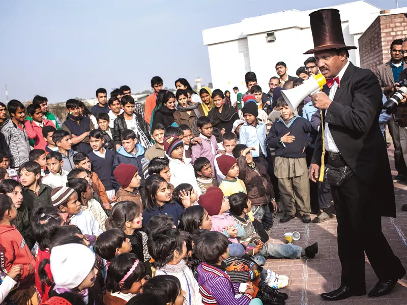 children keenly watching the magic show photo myra iqbal express children keenly watching the magic show photo myra iqbal express
