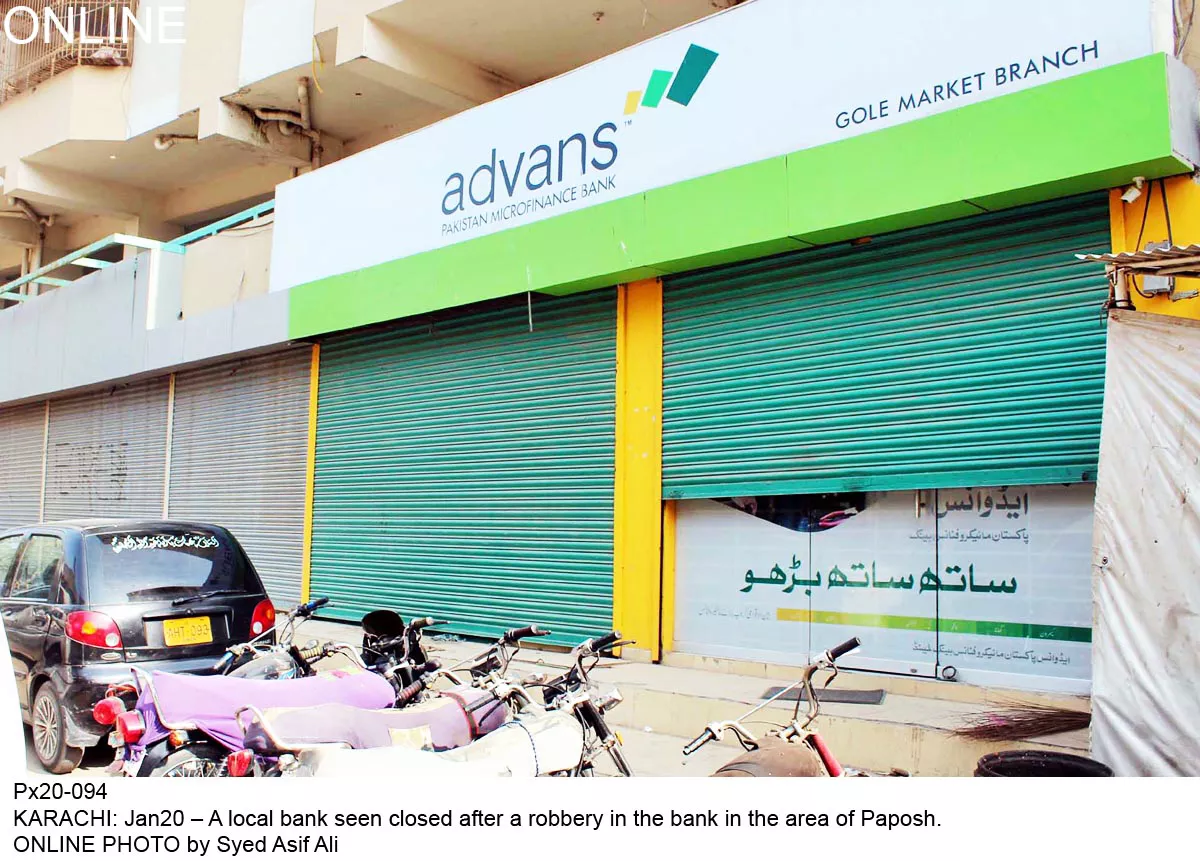 shutters are drawn on the bank which was robbed on monday photo online shutters are drawn on the bank which was robbed on monday photo online