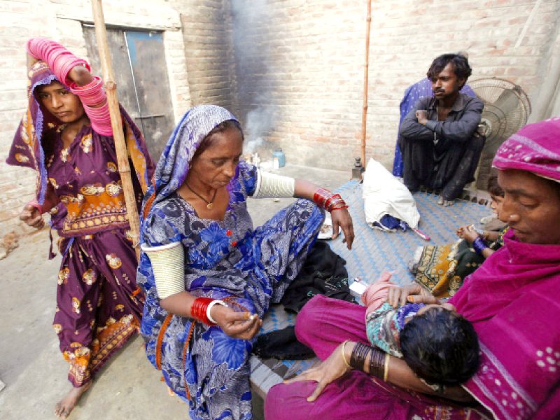 lalee kolhi a freed bonded labourer turned activist sits with her family at their home on the outskirts of hyderabad kolhi worked for more than 20 years for a landlord in slave like conditions before she was freed she has since worked as an activist to lobby the courts and police to rescue other bonded labourers photo file