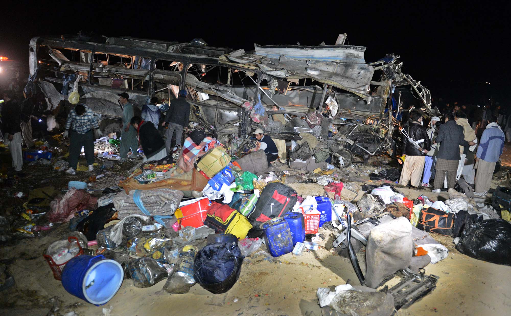 luggage foreground of pilgrims who were traveling in the bus background before being attacked near mastung photo banaras khan express