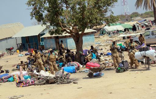 soldiers in south sudan inspect a ransacked market in bor capital of jonglei state photo afp