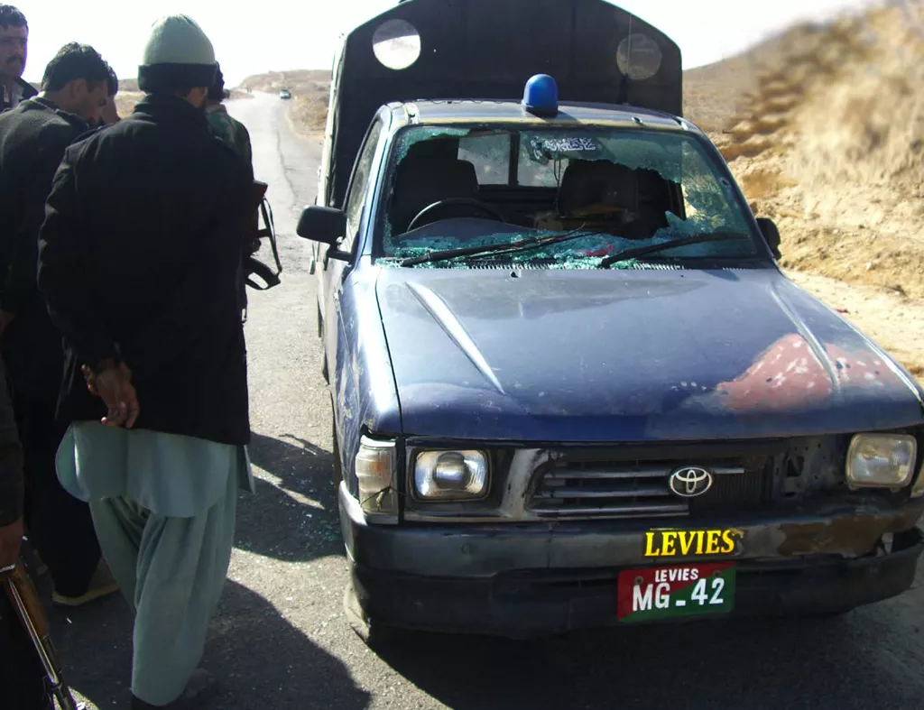 officials inspecting the vehicle damaged in the attack photo express officials inspecting the vehicle damaged in the attack photo express
